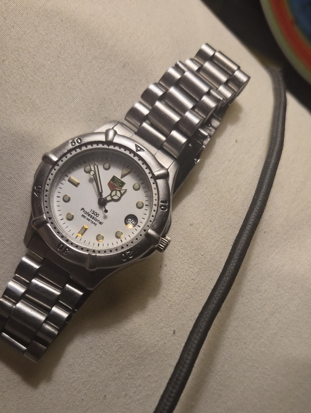 Tag Heuer Stainless Steel Watch with White Dial and Gold Accents